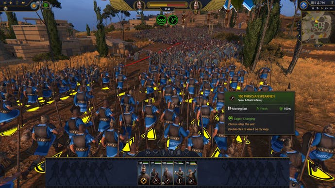 A unit of spearmen charge the enemy in Total War: Pharaoh.