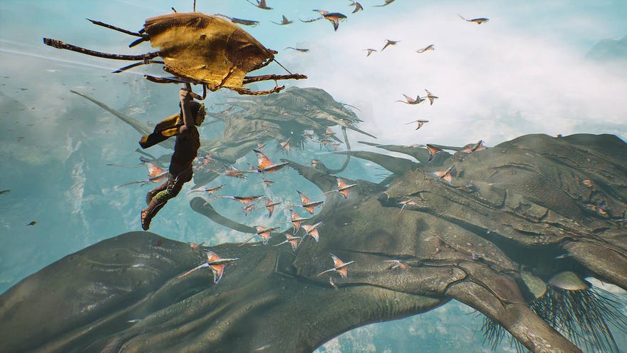 Little guy paraglides through flying whales and other alien critters in a screenshot from Towers Of Aghasba