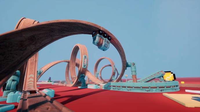 A track arcs upside down in Tren