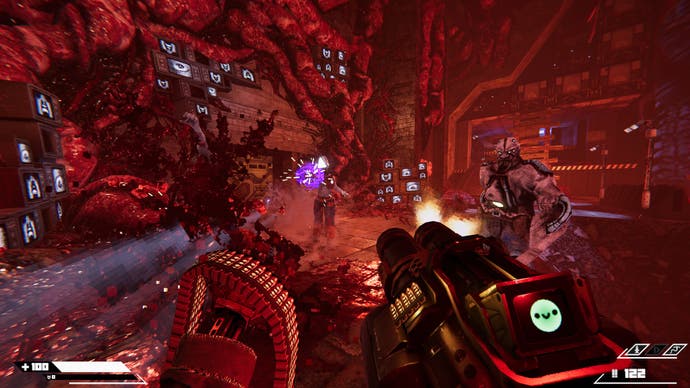 Turbo Overkill screeen showing a totally red room with gooey stuff on the walls and zombie-looking enemies, and a massive gun in the foreground shooting them.