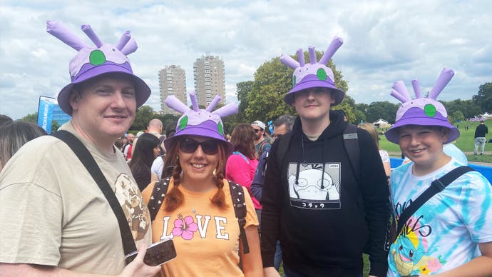 A family of Pokémon Go players wearing custom Goomy hats.