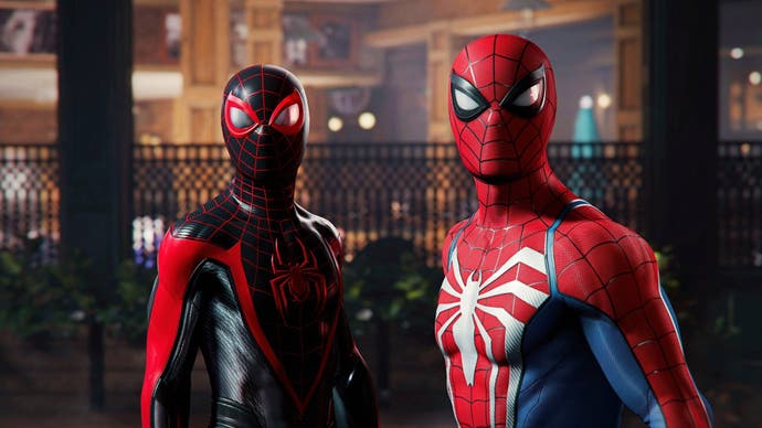 Peter Parker and Miles Morales stand together in Spidey suits in this image from Spider-Man 2.