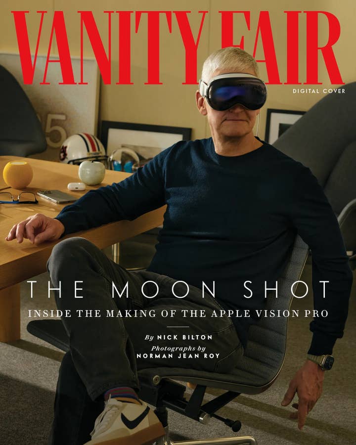 Vanity Fair digital cover showing Tim Cook sitting at a desk wearing the Apple Vision Pro headset. The headline says 