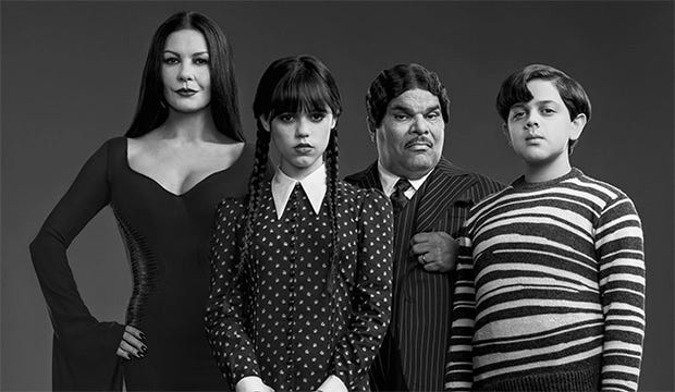 Still promotional image of the full Addams family