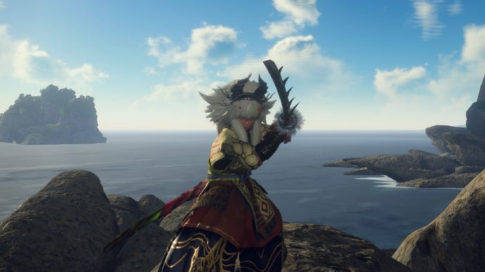 Wild Hearts image showing a player wielding the Karakuri Katana on some rocks by the ocean.