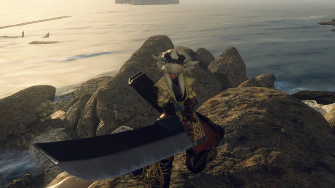 Wild Hearts image showing a player wielding the Nodachi on some rocks at sunset.