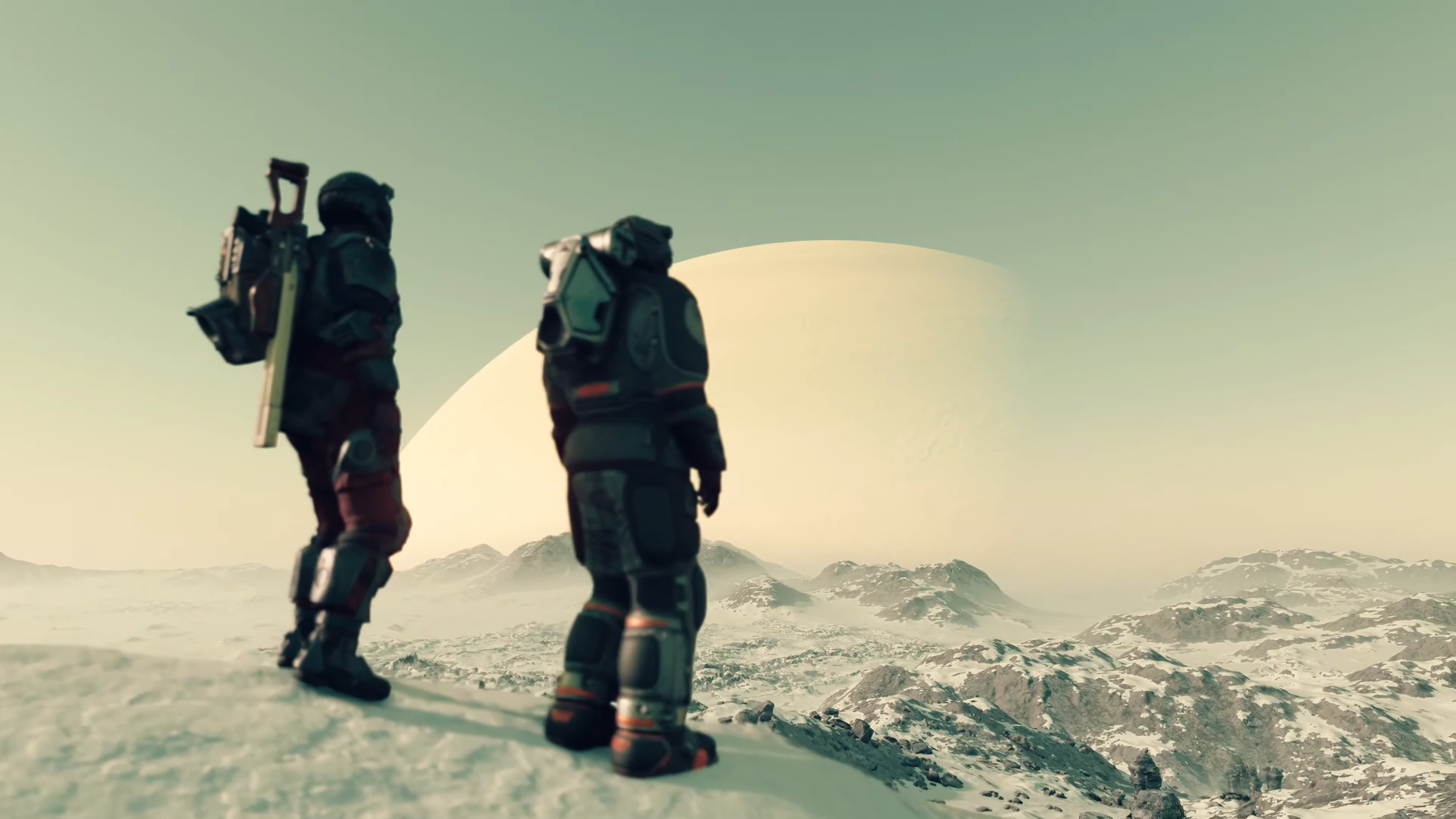Personaje del jugador de Starfield y otro mirando el planeta nevado.