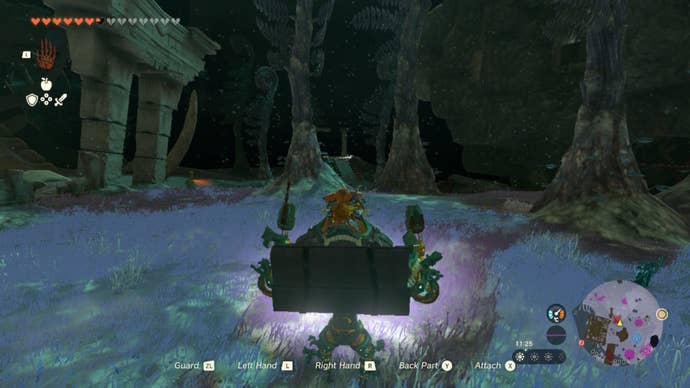 Link, atop Mineru's construct, looks toward an armoury in The Legend of Zelda: Tears of the Kingdom