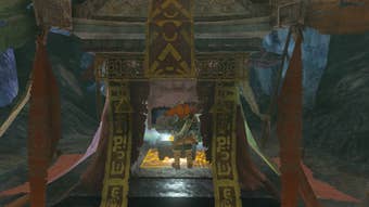 Link opens a chest in a cave in The Legend of Zelda: Tears of the Kingdom