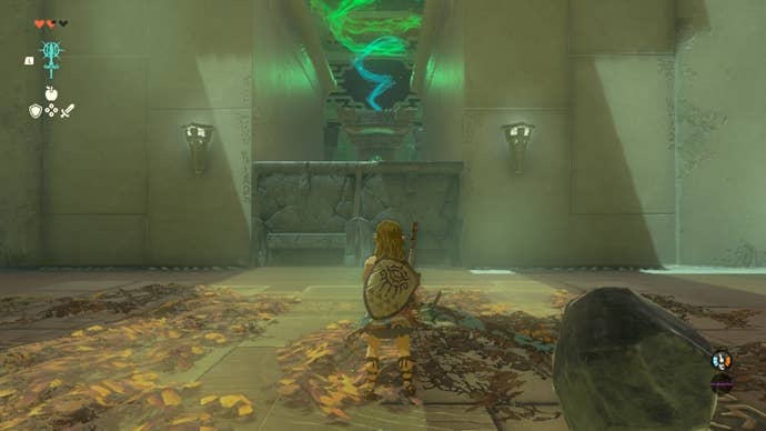 Link looks at a stone door in the In-Isa Shrine in The Legend of Zelda: Tears of the Kingdom