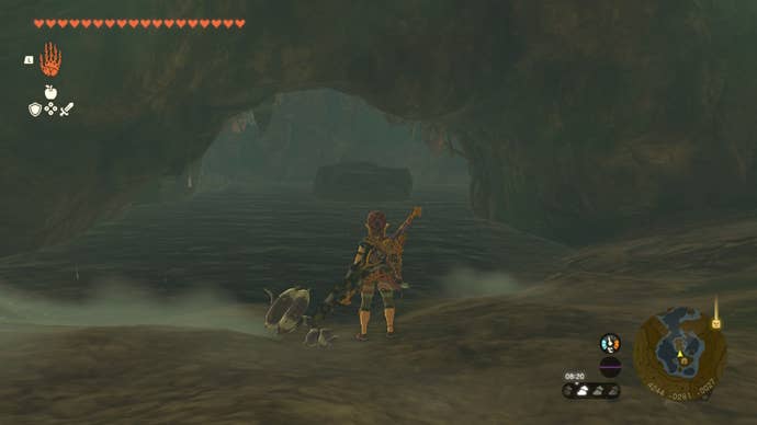 Линк смотрит на каменную платформу в воде в пещере в The Legend of Zelda: Tears of the Kingdom