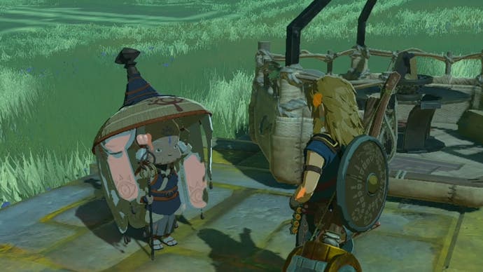 Link standing near Impa and her hot air balloon in The Legend of Zelda: Tears of the Kingdom.