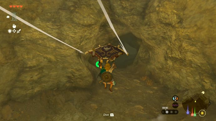Link gliding towards the Tanagar Canyon West Cave in The Legend of Zelda: Tears of the Kingdom.