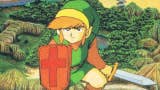 Link holds a sword and shield in a hero shot from the first Legend of Zelda