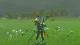 Link wearing the Zora Armor in The Legend of Zelda: Tears of the Kingdom. He appears to be smiling and waving.