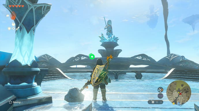 Link standing at an ornate, watery structure where a statue of Mipha can be seen.