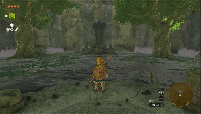 Lien debout près de la printemps de la statue de déesse du pouvoir dans la région de la montagne d'Ulri à Zelda: Tears of the Kingdom