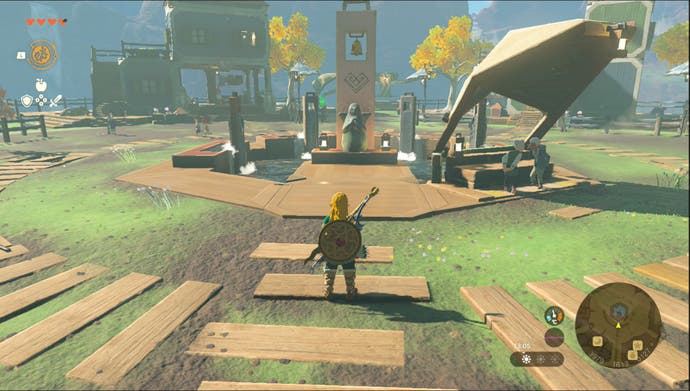 Link parado cerca de la estatua de la diosa de Tarrey Town en la región de la montaña Ulri en Zelda: Tears of the Kingdom.