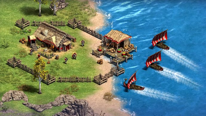 Schiffe nähern sich einem Küstendorf in der Erweiterung Victors and Vanquished von Age of Empires 2: Definitive Edition