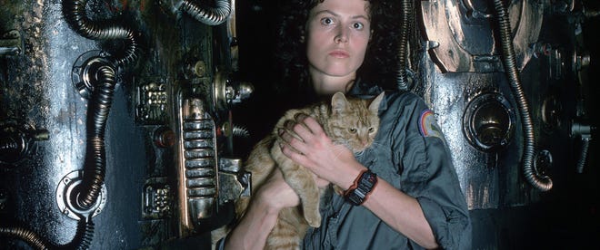 Still from Alien. Sigourney Weaver as Ellen Ripley holding Jonsey the cat