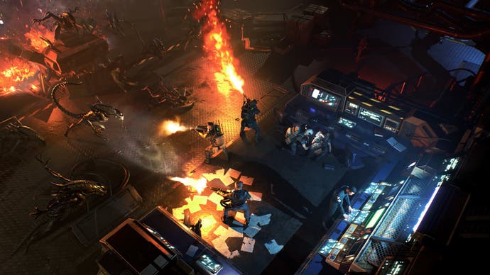 A firefight from the tactics game Aliens: Dark Descent, with a squad of marines trapped in a corner using flamethrowers to repel a horde of Xenomorphs.
