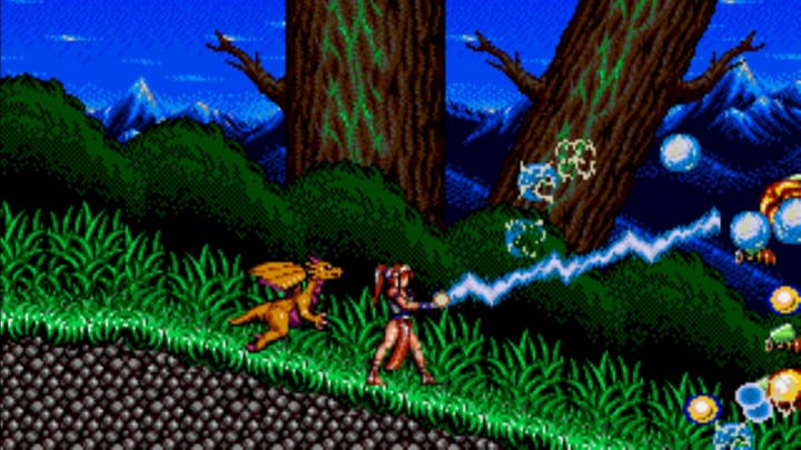 Screenshot of Alisia Dragoon with heroine shooting lightning at flying enemies and a dragon assisting her
