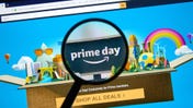 The Amazon Prime Day logo is magnified by a looking glass on a computer screen