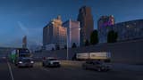 A work-in-progress screenshot of American Truck Simulator's Missouri expansion showing vehicles travelling along a highway at dusk as tall city buildings loom in the background.