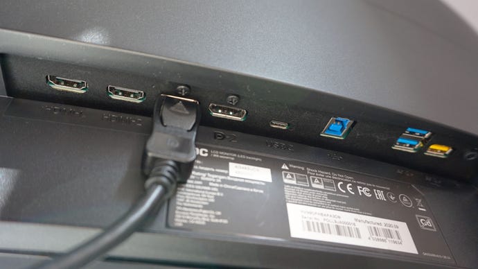 A photo of the AOC Agon AG493UCX gaming monitor's display ports