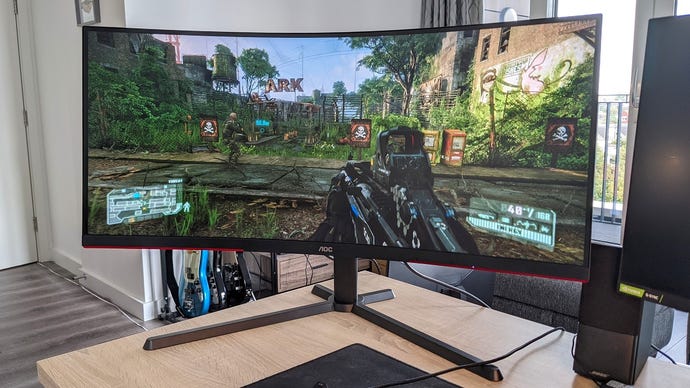 The AOC Agon CU34G3S gaming monitor on a desk.