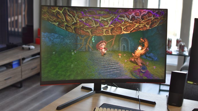 The AOC CQ32G3SU/BK gaming monitor on a desk, running Tiny Tina's Wonderlands.