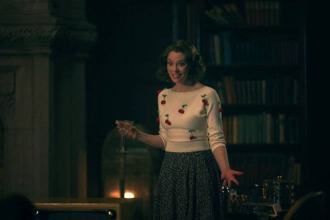 April Bowlby holding a martini glass in Doom Patrol