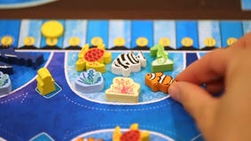 Create a marine paradise in fish-placement board game Aqua Garden