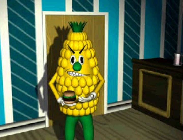A man-size corn person in a living room near a TV frowns angrily as it gestures with one hand toward a hamburger it holds in the other hand