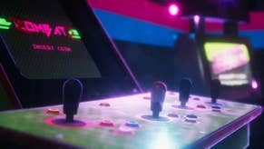 A close-up of an arcade controller area, joysticks and buttons lit by the soft light of the screen. Heaven.