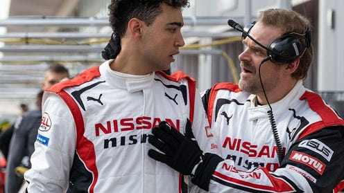 Still image from Gran Turismo movie featuring Jann and his trainer