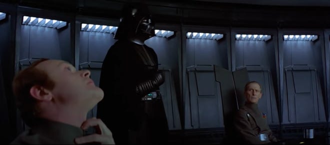 Still image from A New Hope featuring Darth Vader choking an officer