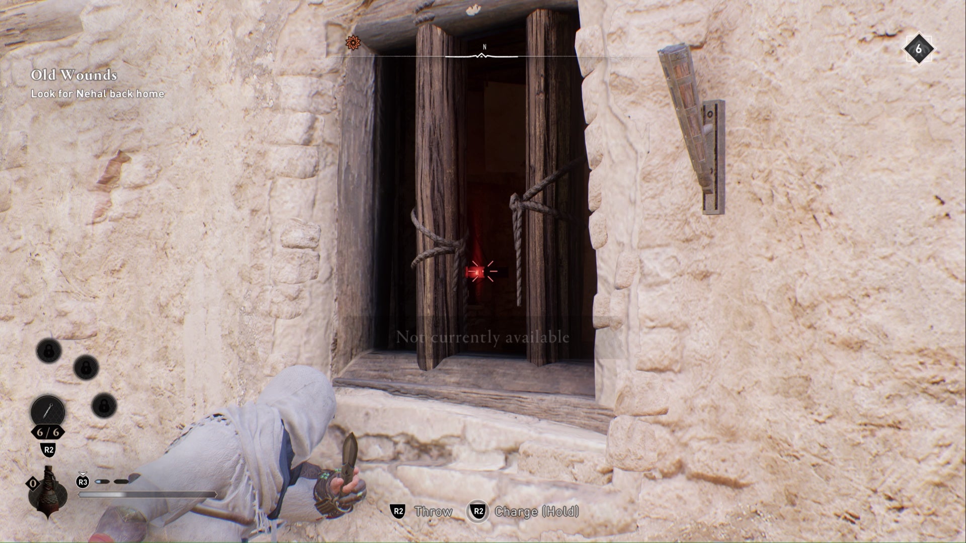 Assassins Creed Mirage Un desafío Enigma Basim apuntando con un cuchillo a la cerradura a través de la ventana