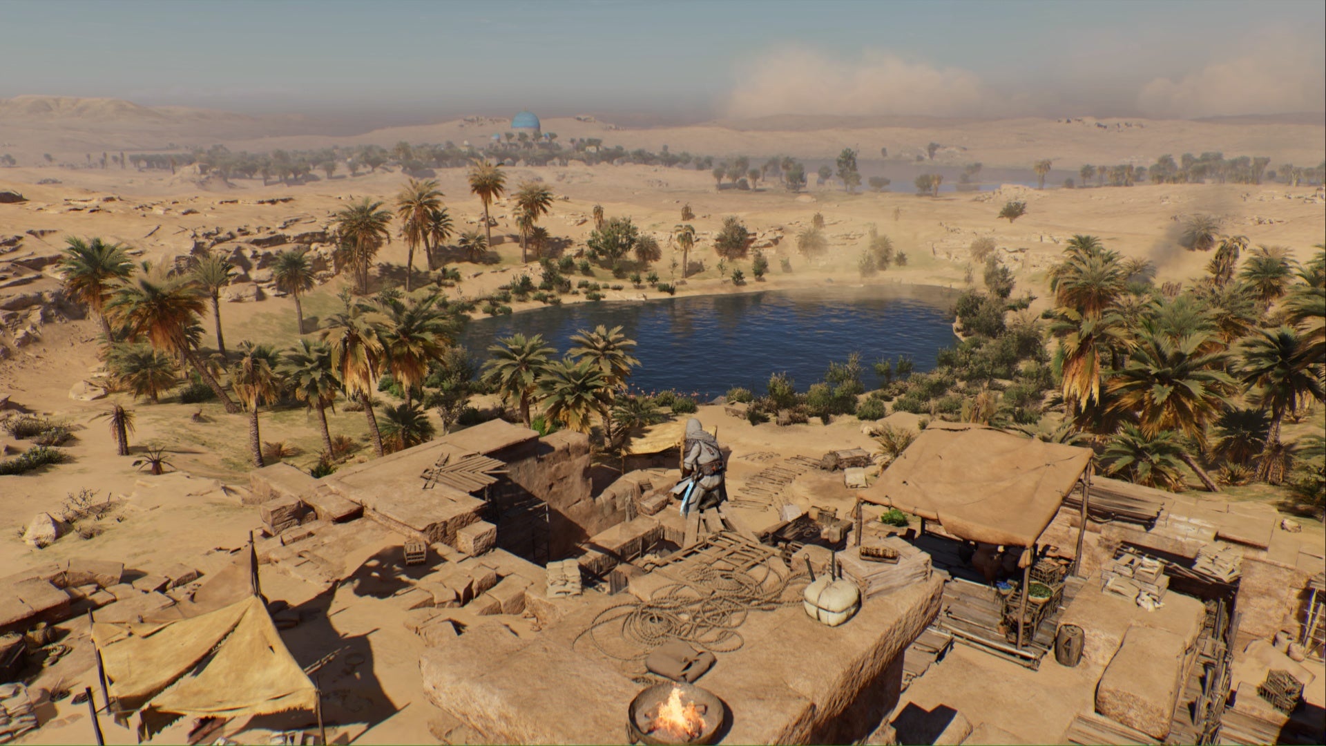 Assassins Creed Mirage Basim en cuclillas sobre el techo con vistas al oasis del norte
