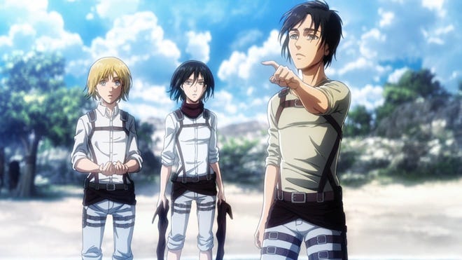 Eren, Armin and Mikasa in the hit anime series Attack on Titan.