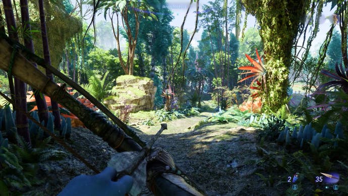 Bertie's Na'vi looks out at a dense and colourful jungle before them, half of it in sunlight, half in shade.