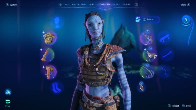 The menu in the new Avatar game. We see a blue-skinned Na'vi at the centre of it, with equipment slots on the right and left of them, and then a carousel of sub-menus to flip through at the top of the screen.