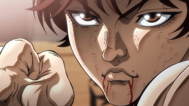 A character stares intently, as a few trickles of blood fall from their mouth, in the popular Netflix anime show Baki.