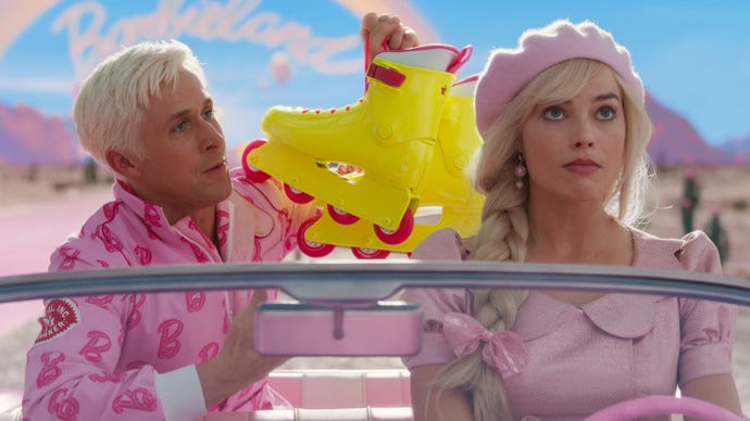 Barbie is sat in the driver's seat of a pink car, she looks unimpressed, Ken is holding up neon rollerskates.