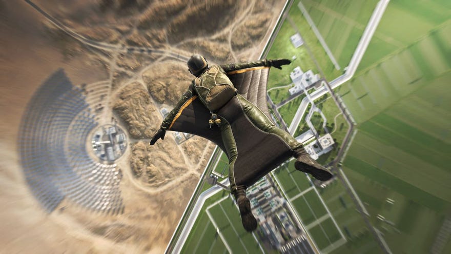 A soldier dives in a wingsuit, flying over a map in Battlefield 2042. Half is a desert, while the other half is an enclave full of lush fields and orderly roads.