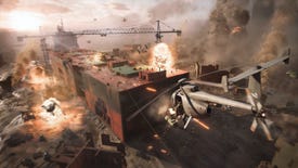 A wide shot showing a pitched battle in Battlefield 2042, taking place on a partially destroyed, beached cargo ship. Drones, helicopters and explosions are all in play