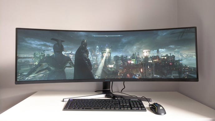 A photo of an ultrawide gaming monitor running Batman Arkham Knight