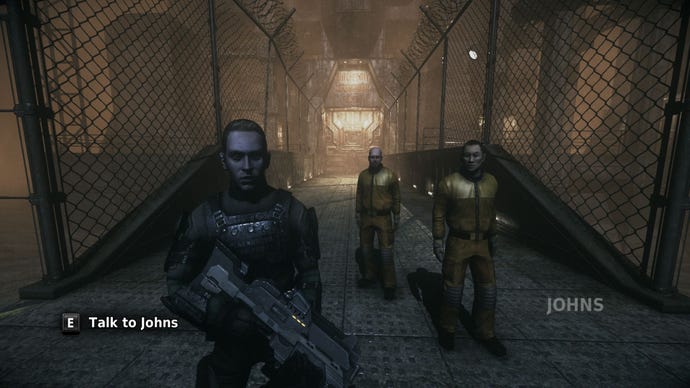 A soldier named Johns and two prisoners in yellow jumpsuits stand in front of you in The Chronicles of Riddick: Escape From Butcher Bay