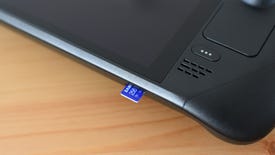 A Samsung Pro Plus microSD card partially inserted into the microSD card slot of a Steam Deck.
