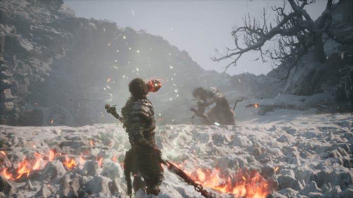 black myth wukong screenshot showing the character drinking a potion in a field of short white plants, with flames around their feet and an enemy in the distance